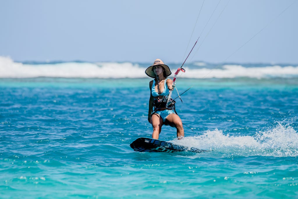 A Woman Kite Surfing on the Sea