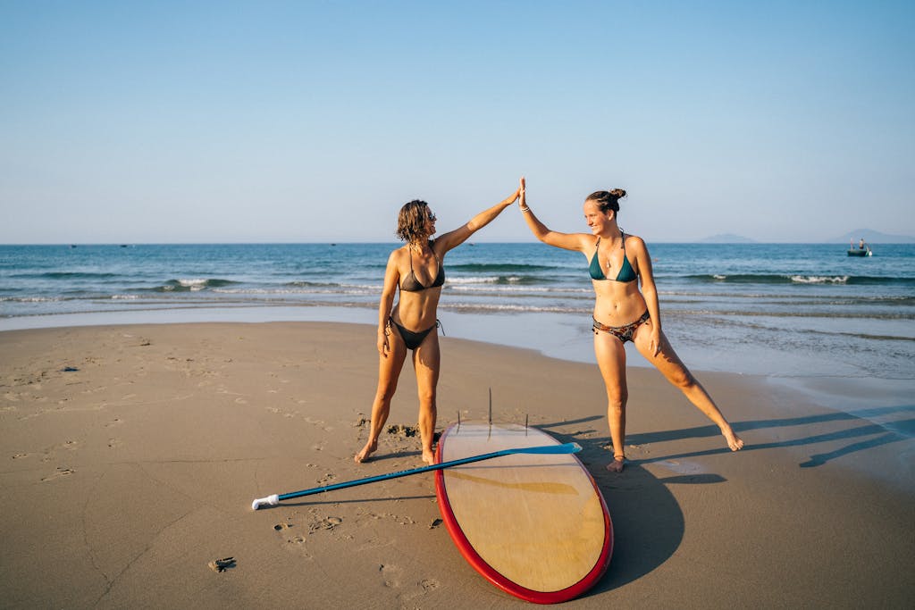 Women in a Bikini Doing High Five